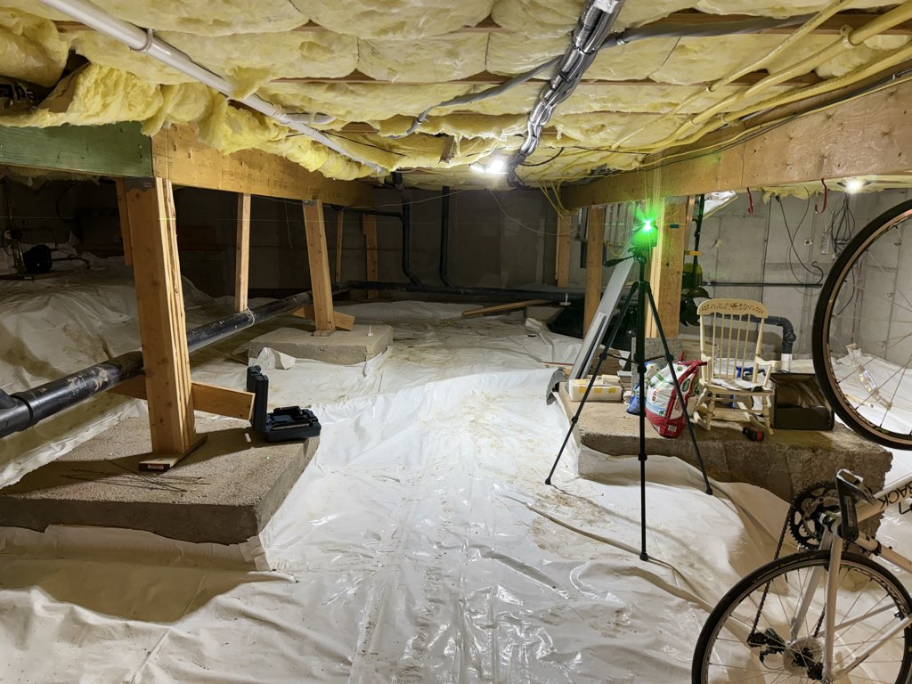 Clean encapsulated crawl space with white vapor barrier