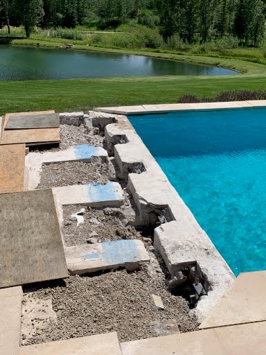 Pool shell and deck dug out and staged for pier installation